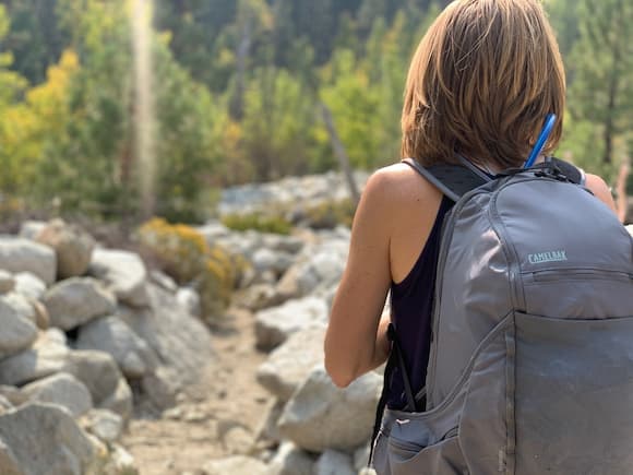 woman hiker wearing daypack