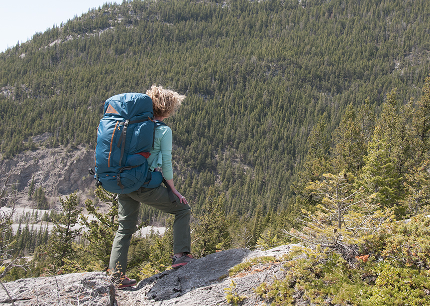 woman hiker wearing expedition backpack