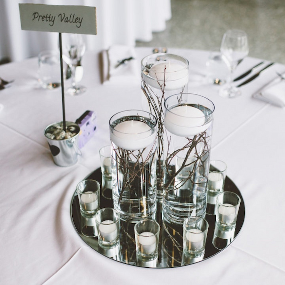 mirror wedding centrepiece on top with floating candles