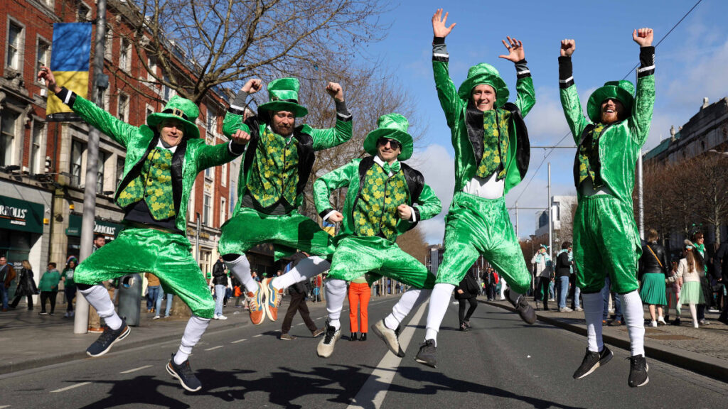 Five man wear everything green on st. patrick's day on the street